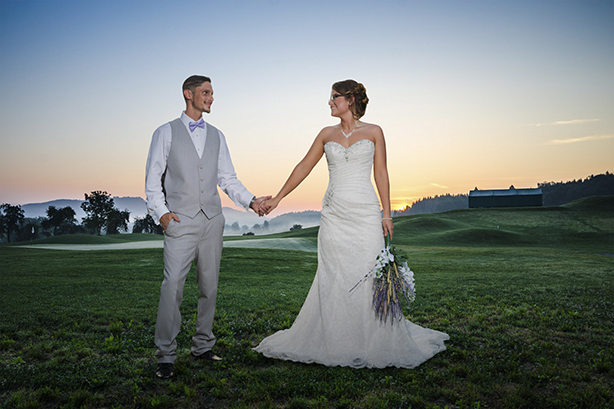 couple holding hands in a suit and wedding dress for wedding picture